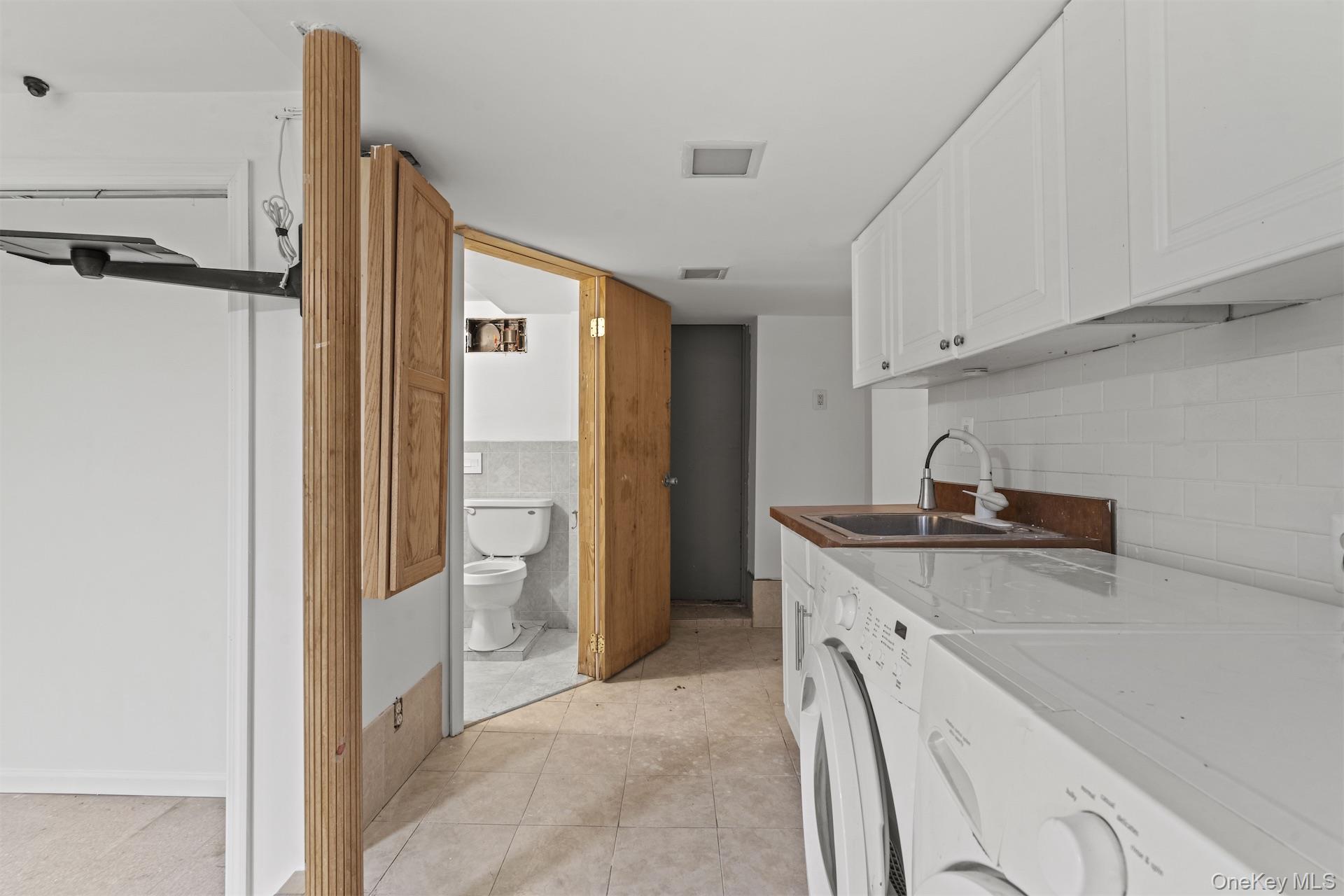 44 Decatur Street, Unit 1 Brooklyn, NY 11216 - Photo 17 of 18 a kitchen with a sink and a refrigerator