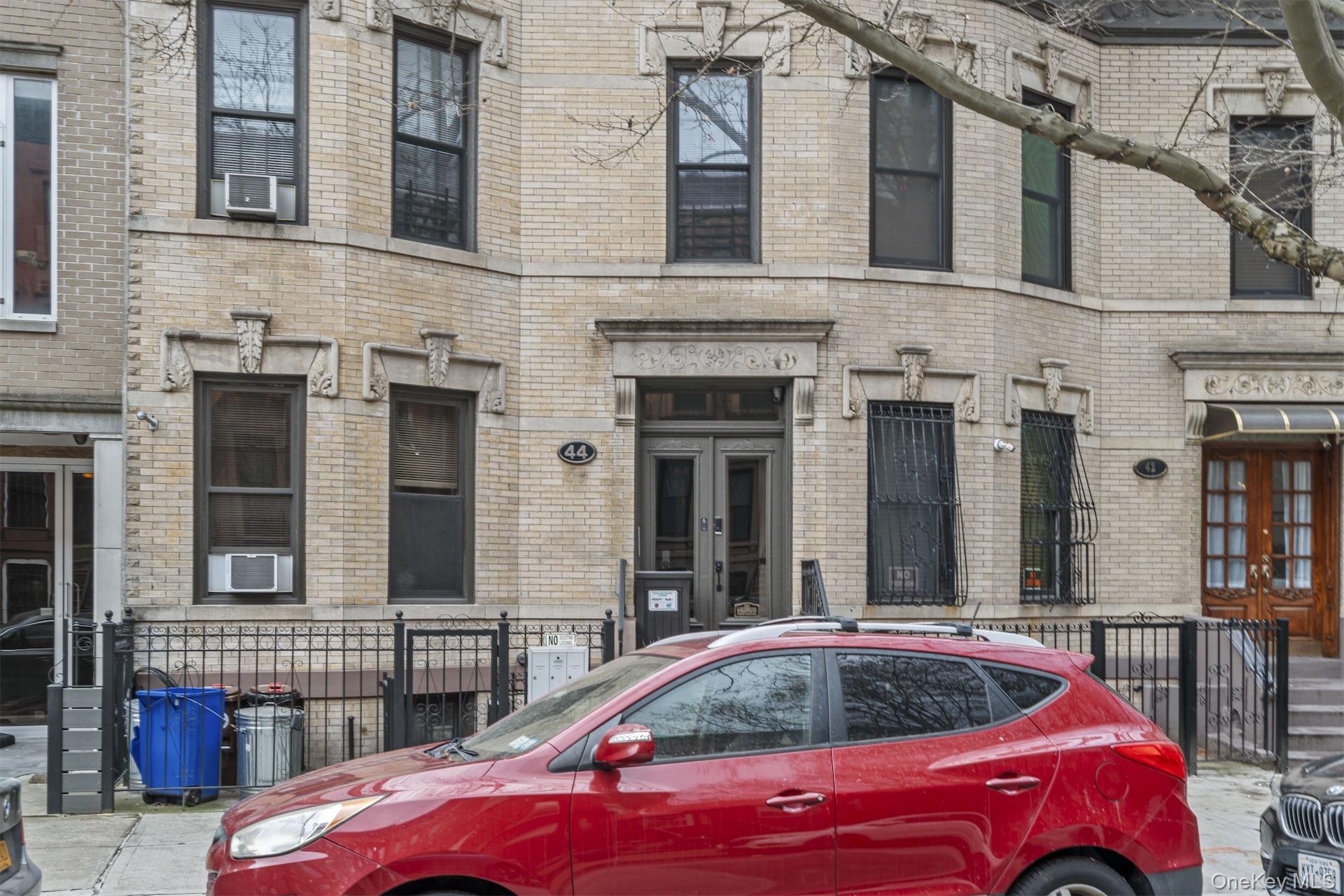 44 Decatur Street, Unit 1 Brooklyn, NY 11216 - Photo 2 of 18 a front view of a building with parking space