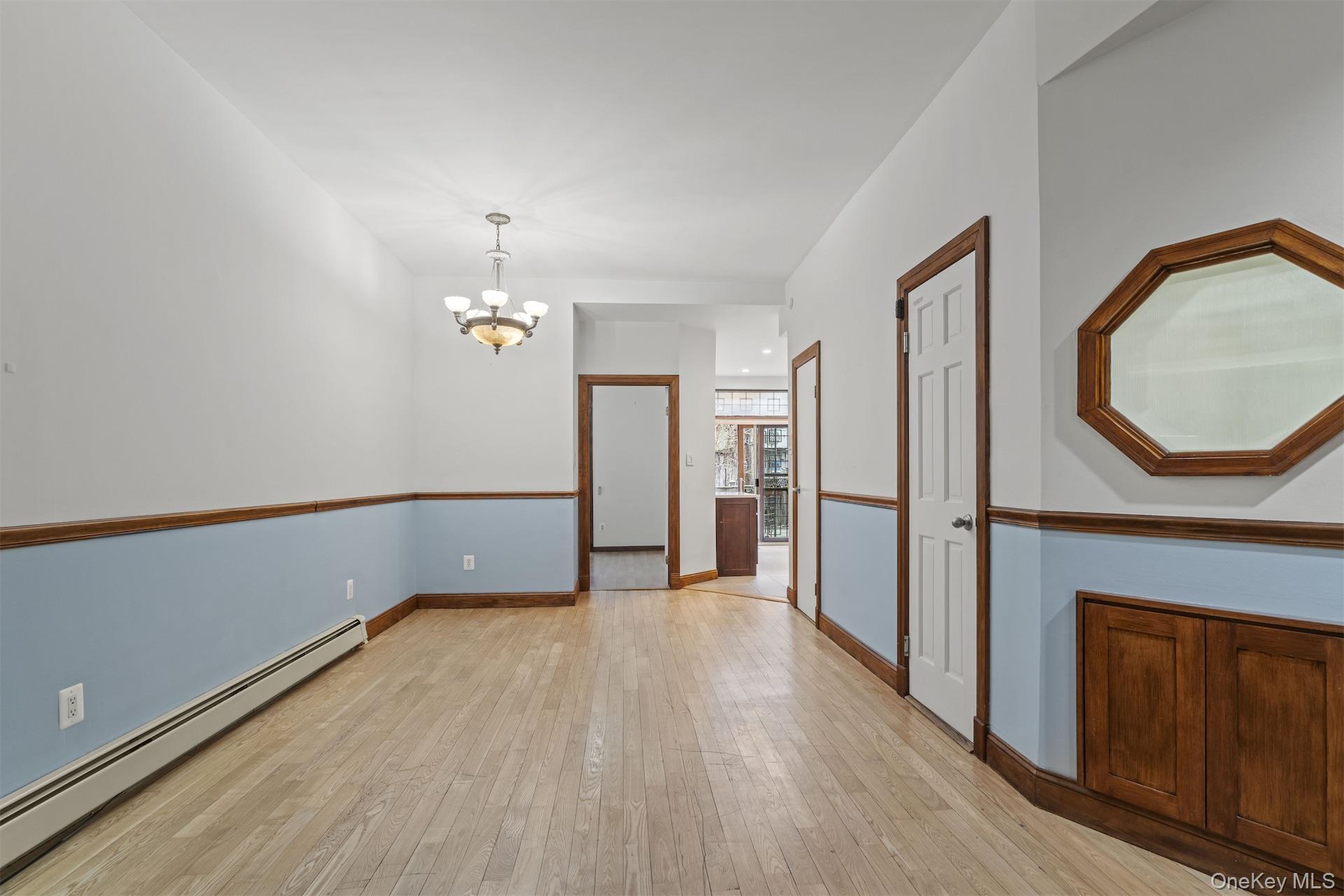 44 Decatur Street, Unit 1 Brooklyn, NY 11216 - Photo 4 of 18 a view of empty room with wooden floor and fan