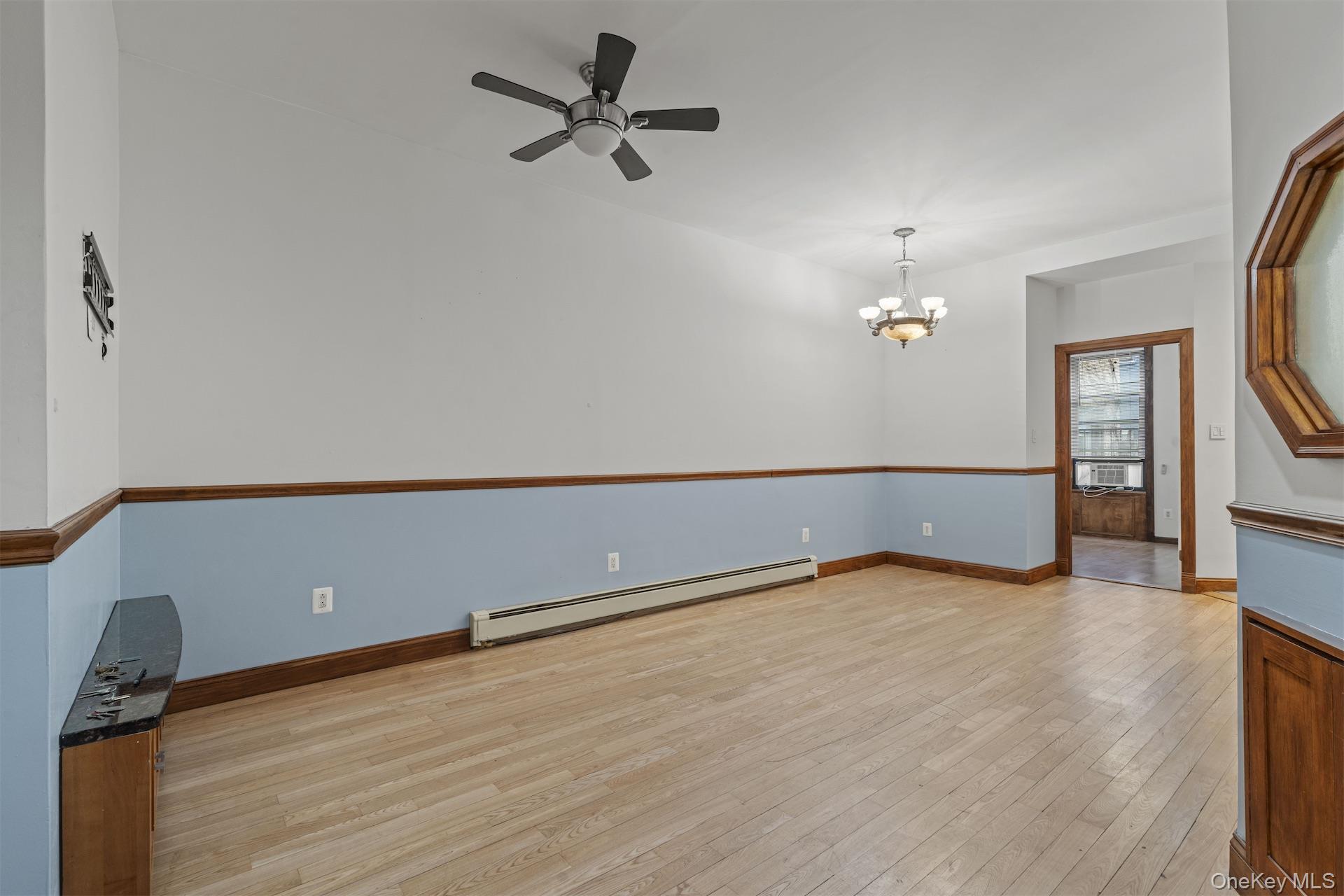 44 Decatur Street, Unit 1 Brooklyn, NY 11216 - Photo 5 of 18 a view of an empty room with wooden floor and a window