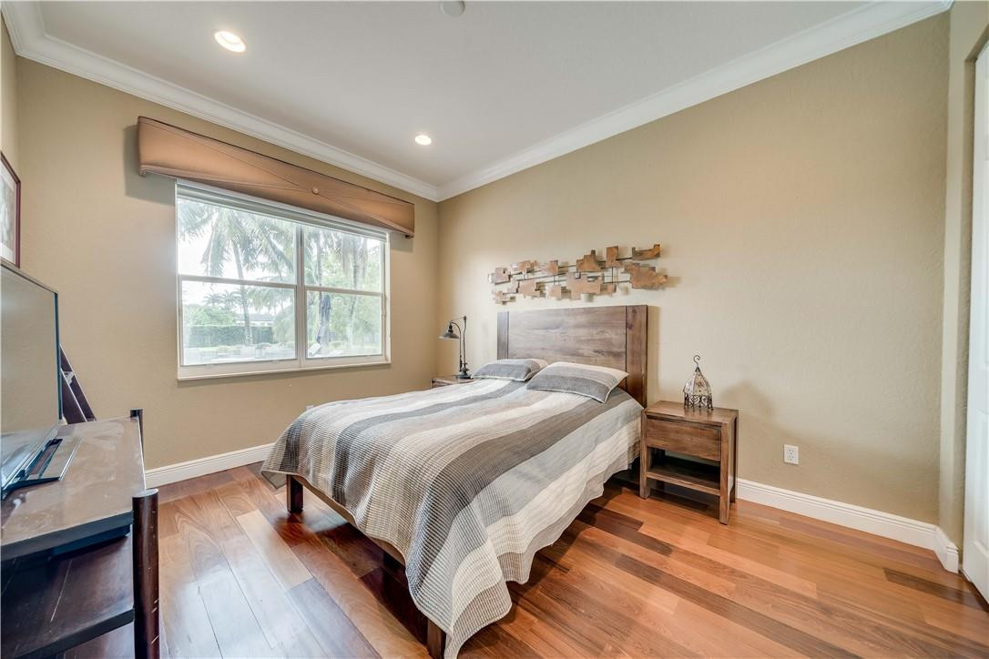 10508 Laurel Road Davie, FL 33328 - Photo 13 of 82 a bedroom with a bed and a window