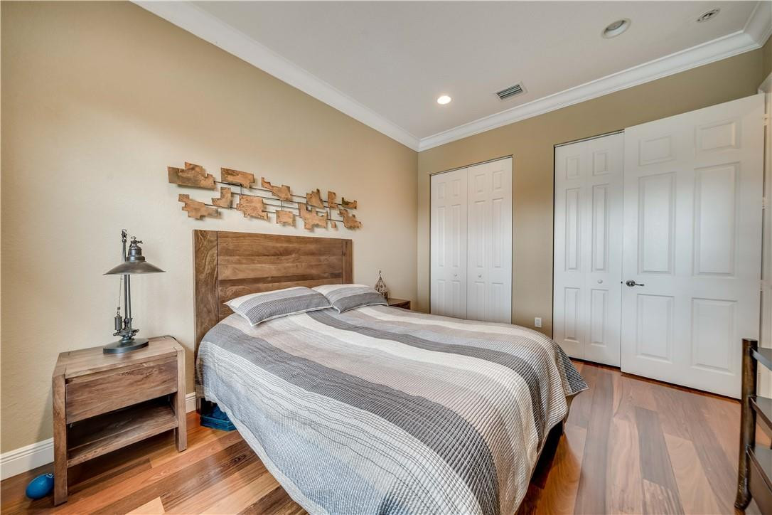 10508 Laurel Road Davie, FL 33328 - Photo 14 of 82 a bedroom with a bed and a chair