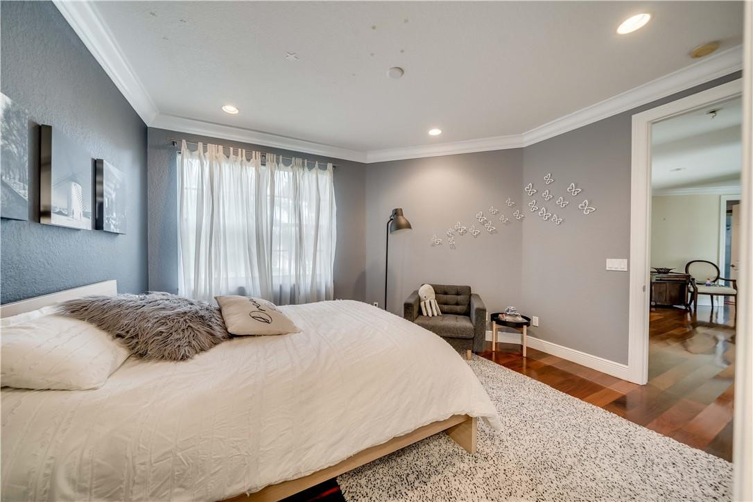 10508 Laurel Road Davie, FL 33328 - Photo 25 of 82 a bedroom with a bed and wooden floor