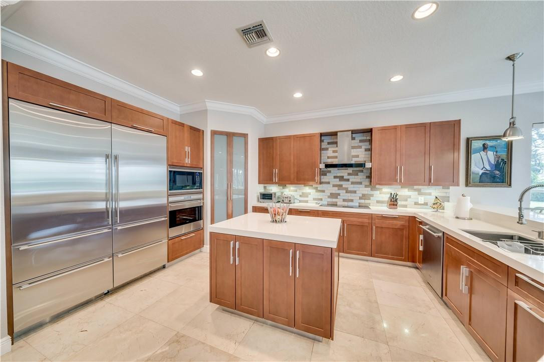 10508 Laurel Road Davie, FL 33328 - Photo 28 of 82 a large kitchen with stainless steel appliances lots of counter space sink and cabinets
