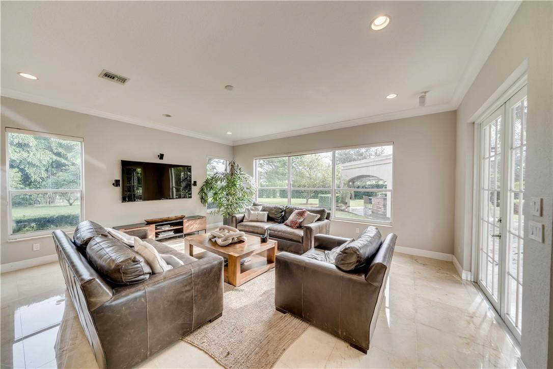 10508 Laurel Road Davie, FL 33328 - Photo 35 of 82 a living room with furniture and a large window