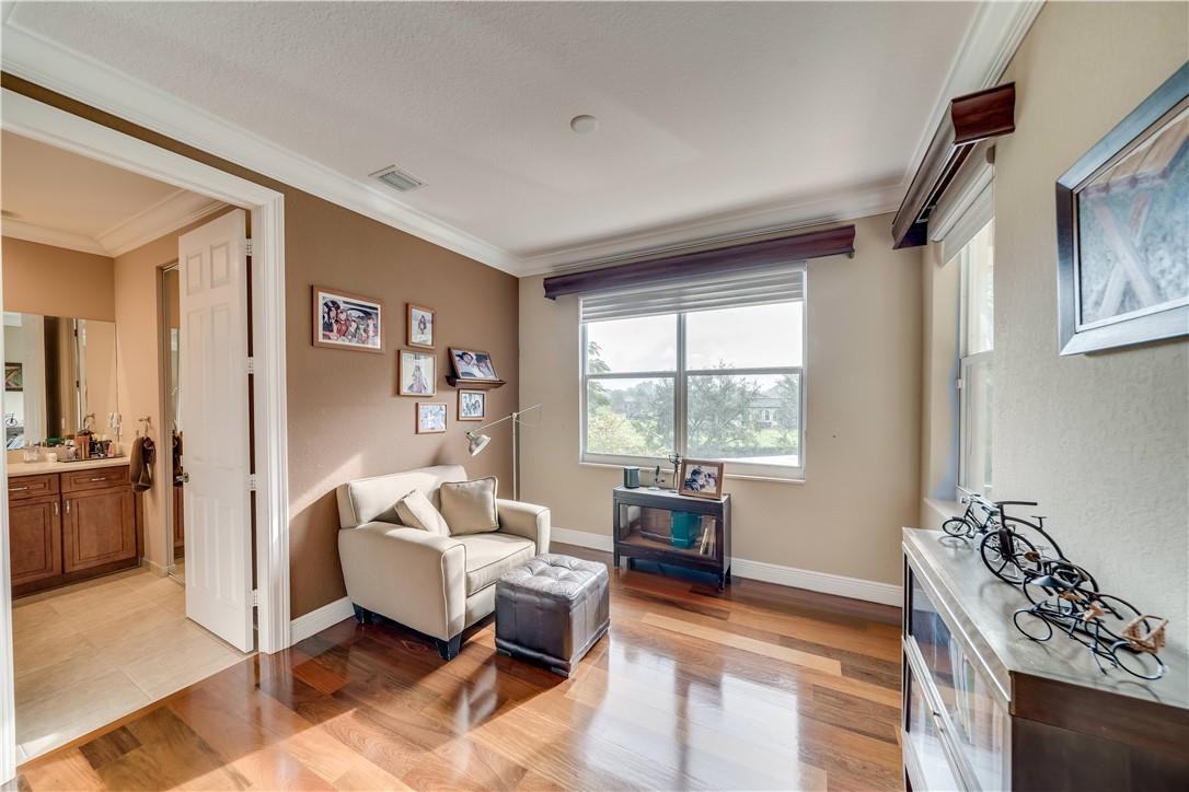 10508 Laurel Road Davie, FL 33328 - Photo 42 of 82 a living room with furniture floor to ceiling window and a wooden floor