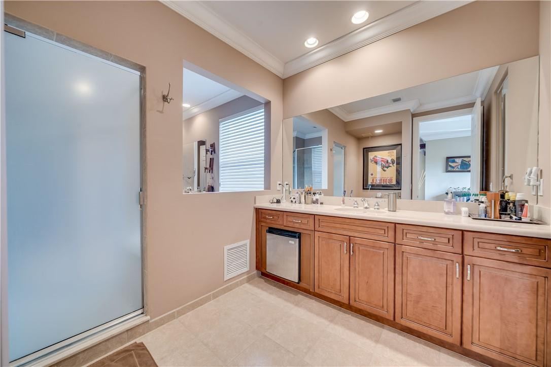 10508 Laurel Road Davie, FL 33328 - Photo 44 of 82 a spacious bathroom with a double vanity sink and a mirror