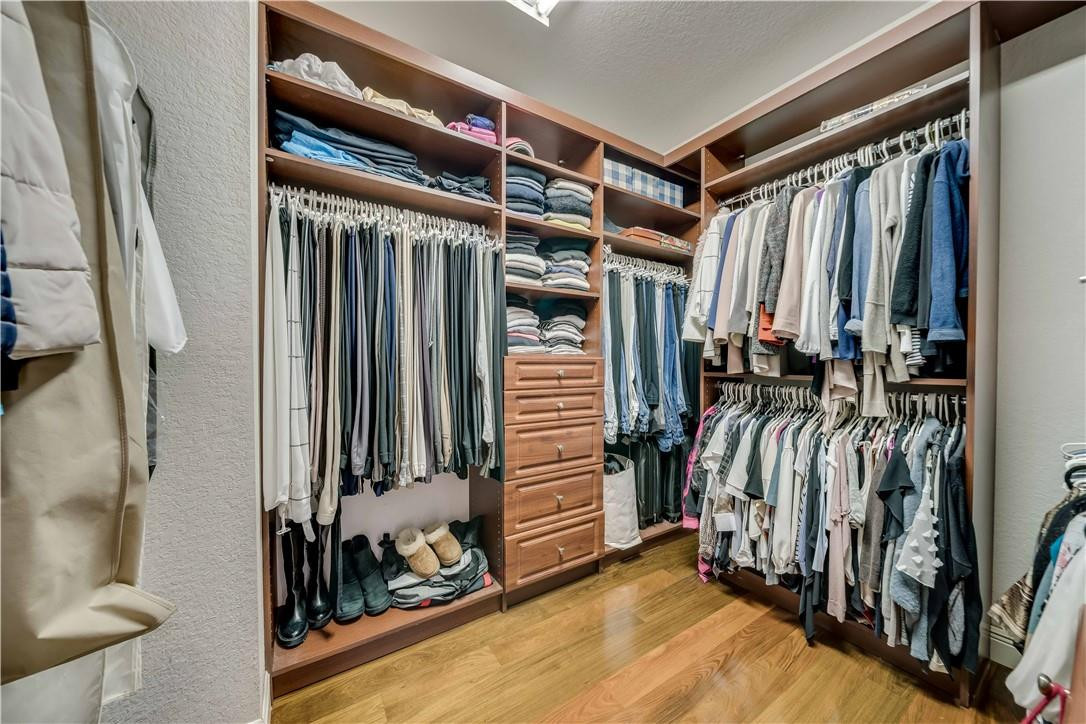 10508 Laurel Road Davie, FL 33328 - Photo 47 of 82 a view of walk in closet with clothes and shoes