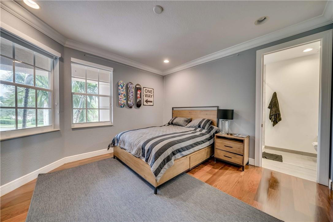 10508 Laurel Road Davie, FL 33328 - Photo 48 of 82 a spacious bedroom with a bed and window