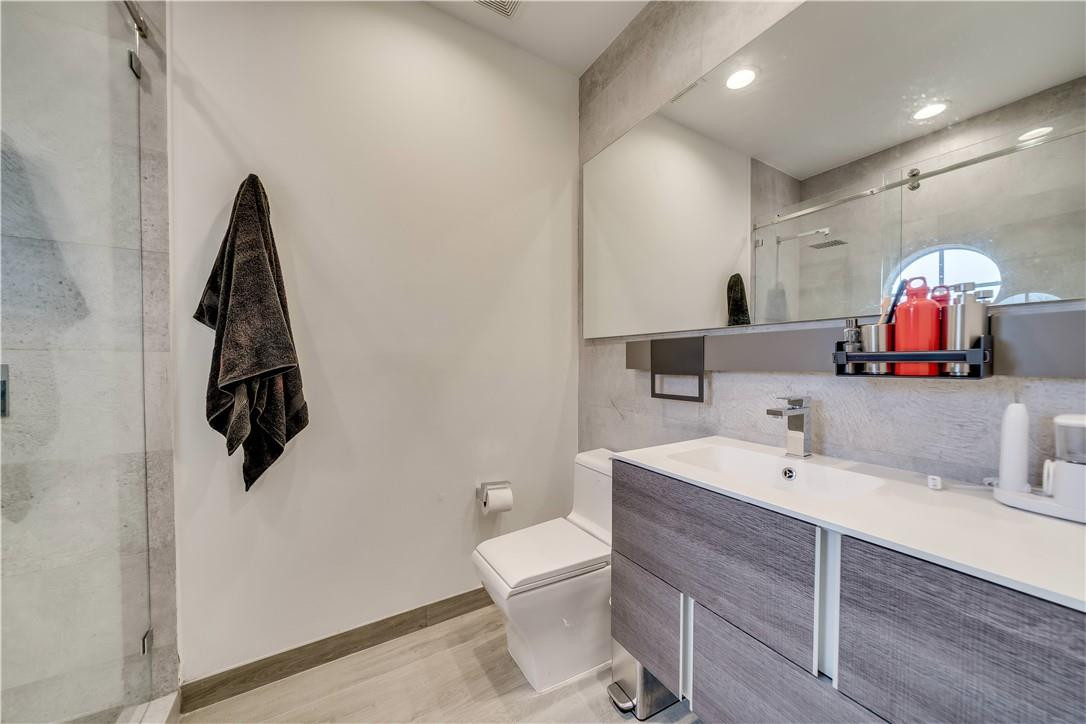 10508 Laurel Road Davie, FL 33328 - Photo 51 of 82 a bathroom with a sink a toilet and a mirror