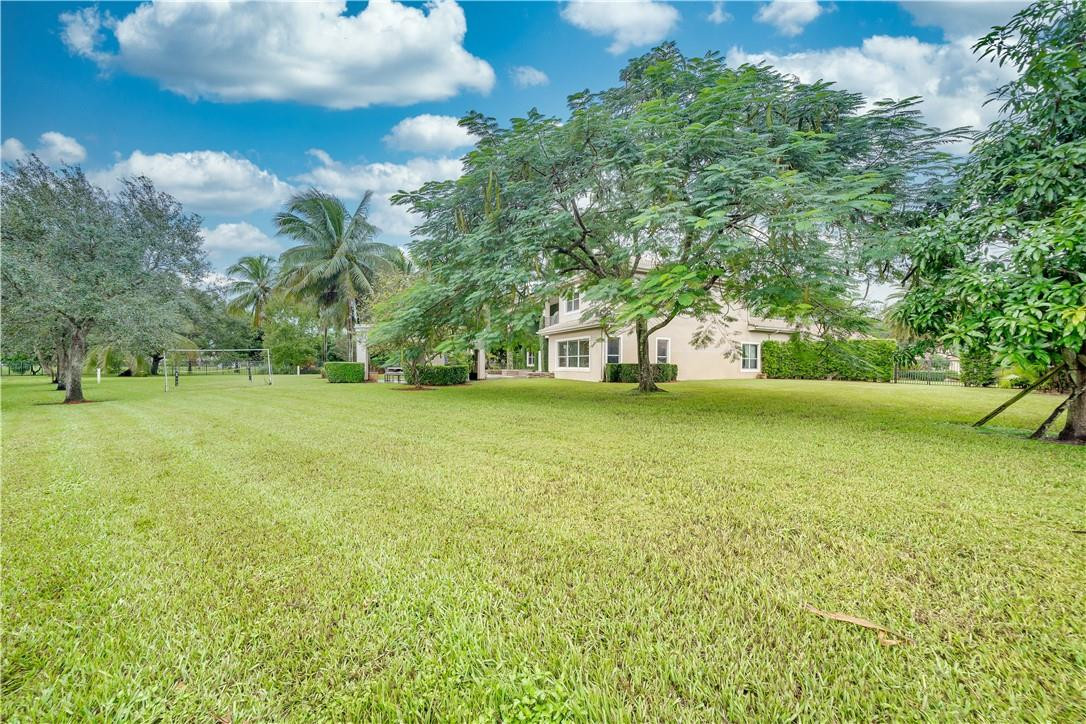 10508 Laurel Road Davie, FL 33328 - Photo 65 of 82 a view of yard with swimming pool and green space