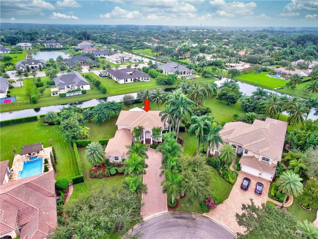 10508 Laurel Road Davie, FL 33328 - Photo 70 of 82 an aerial view of residential houses with outdoor space and lake view