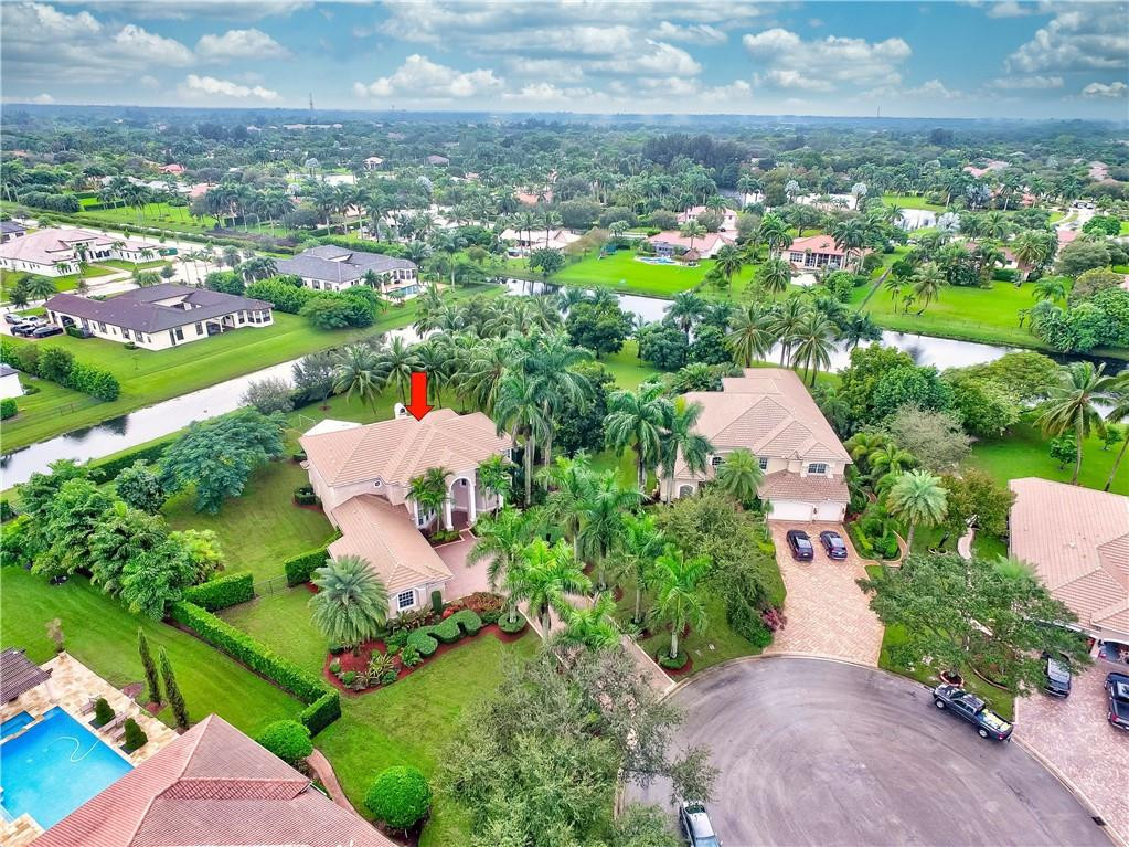 10508 Laurel Road Davie, FL 33328 - Photo 71 of 82 an aerial view of residential houses with outdoor space and trees