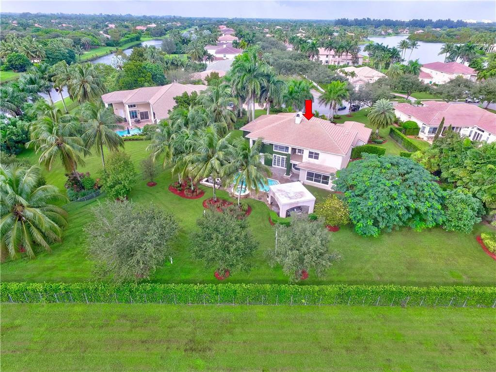 10508 Laurel Road Davie, FL 33328 - Photo 77 of 82 an aerial view of green landscape with trees houses and mountain view