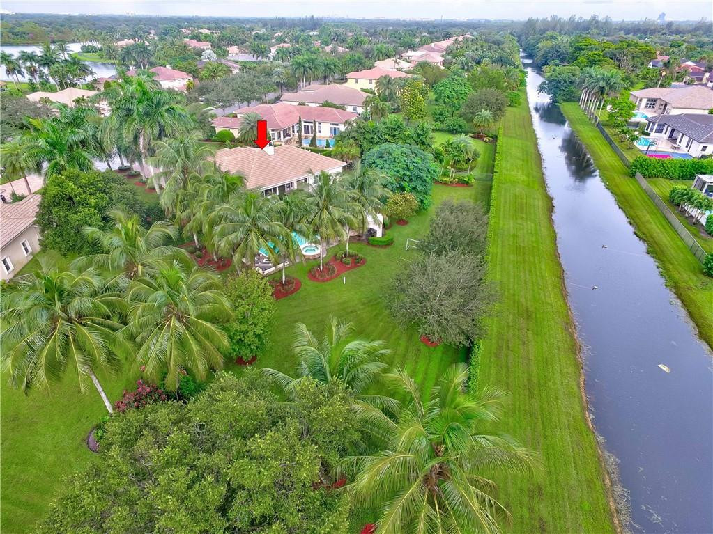 10508 Laurel Road Davie, FL 33328 - Photo 79 of 82 an aerial view of residential houses with outdoor space and trees