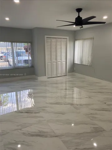 a view of an empty room with a window