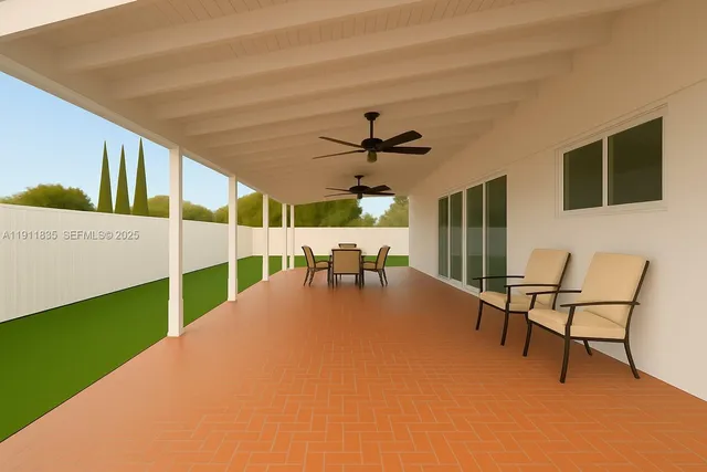 a view of a livingroom with furniture and a ceiling fan