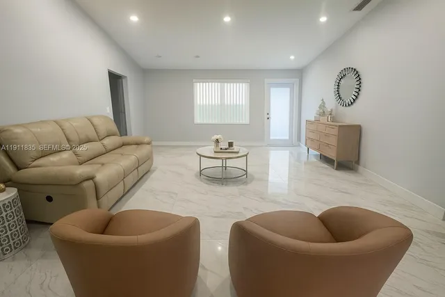 a living room with furniture and a couch