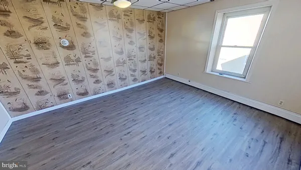 a view of wooden floor in a bathroom