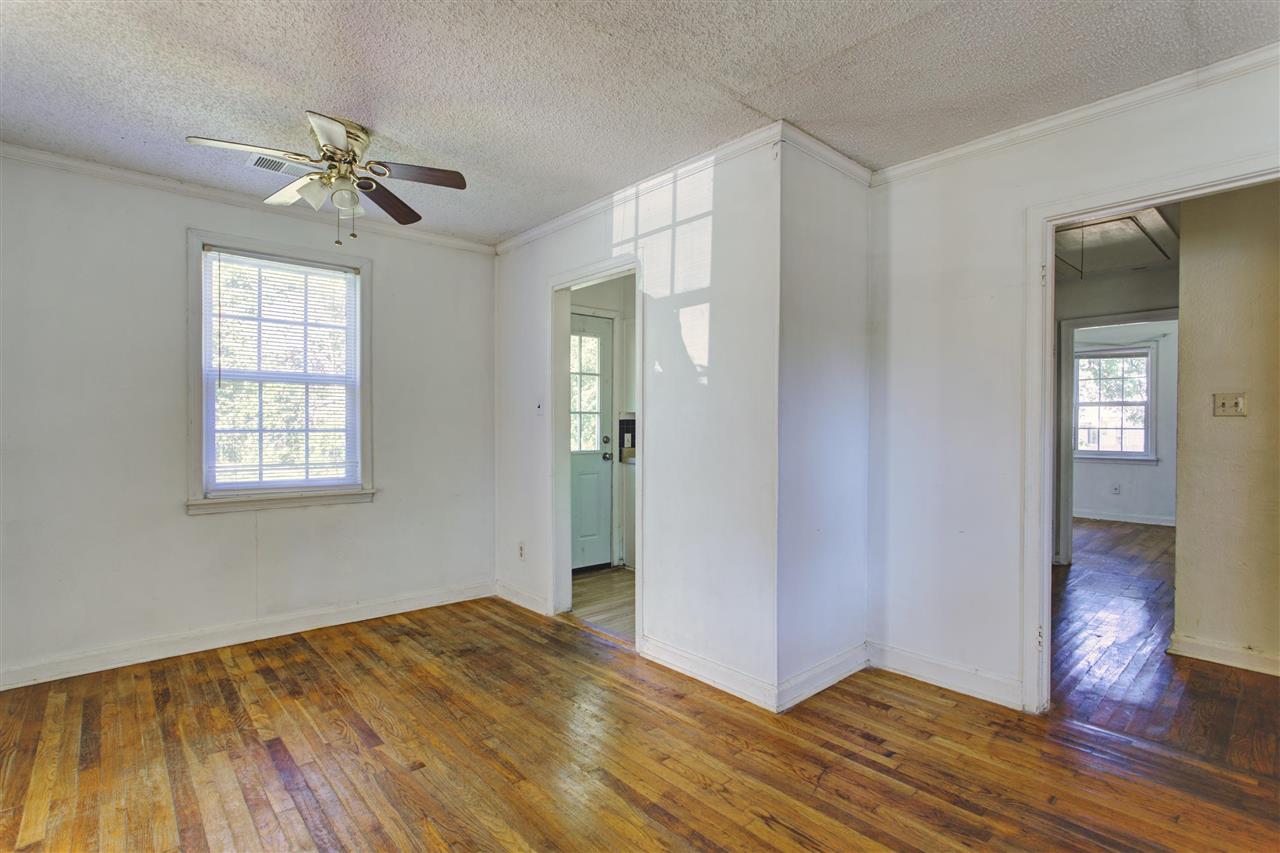 903 Tatum Road Memphis, TN 38122 - Photo 5 of 10 a view of empty room with wooden floor
