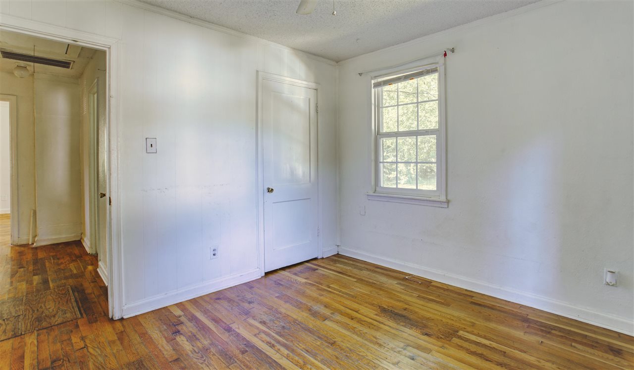903 Tatum Road Memphis, TN 38122 - Photo 10 of 10 an empty room with wooden floor and windows