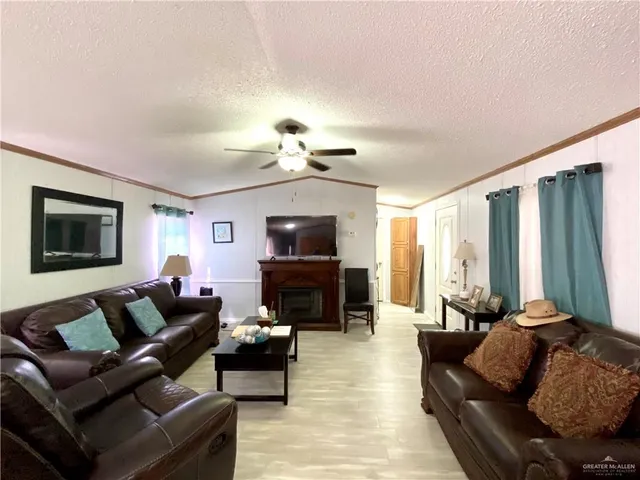 a kitchen with a stove a sink a dining table and chairs