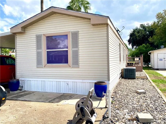 a bedroom with a bed and a ceiling fan