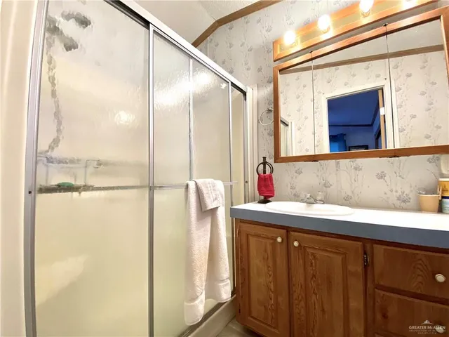 a bathroom with a sink and mirror