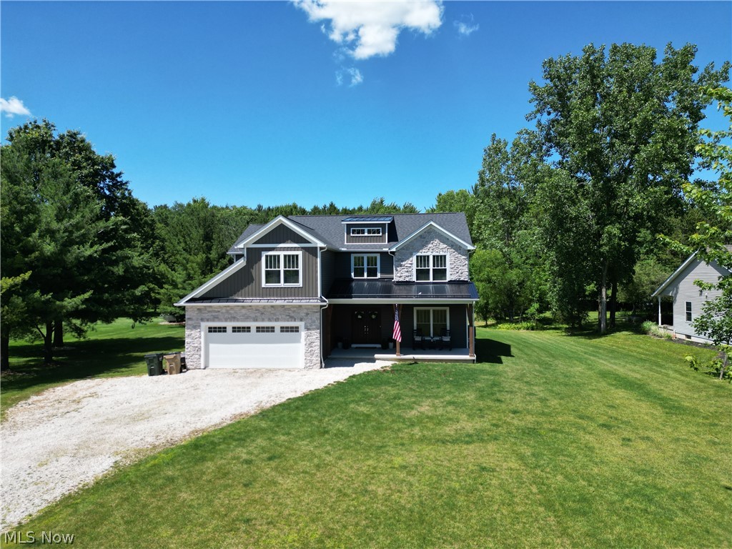 4553 Sharon Copley Road Medina, OH 44256 - Photo 1 of 32 Contemporary two-story residence featuring a mixed material facade with stone veneer and horizontal siding