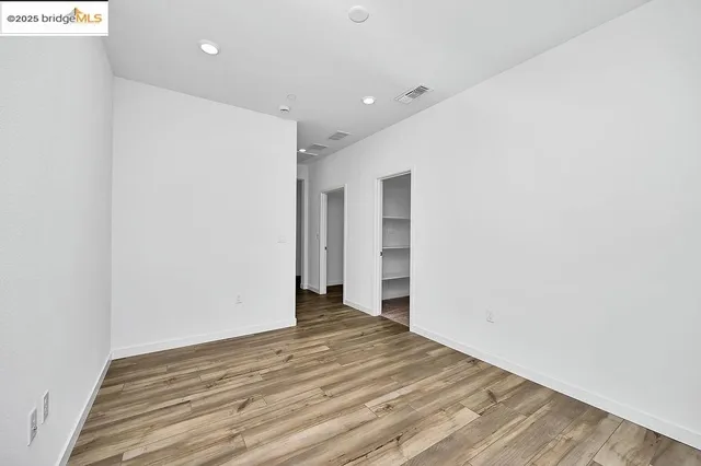a view of a livingroom with wooden floor
