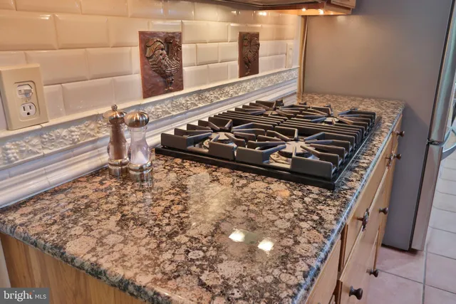 a kitchen with stainless steel appliances a sink and cabinets