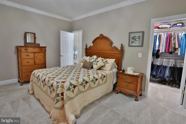 a view of a livingroom with a chandelier fireplace and a window