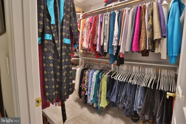 a living room with furniture and a lamp