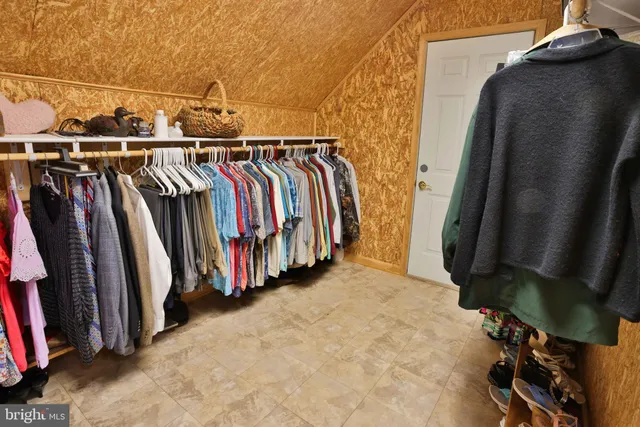 a view of a porch with wooden floor and fence