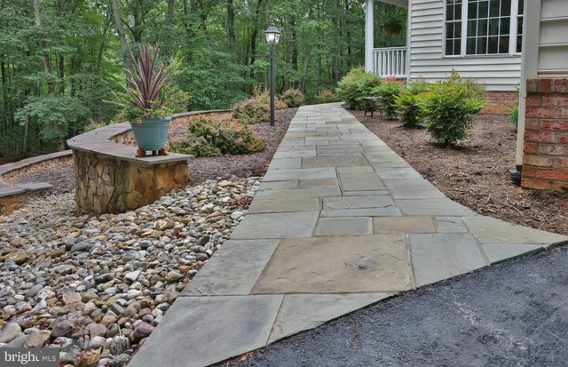 a view of a pathway with a yard