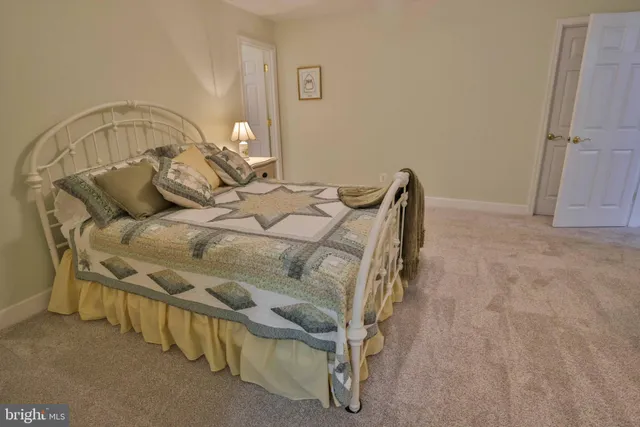 a view of a porch with a table and chairs
