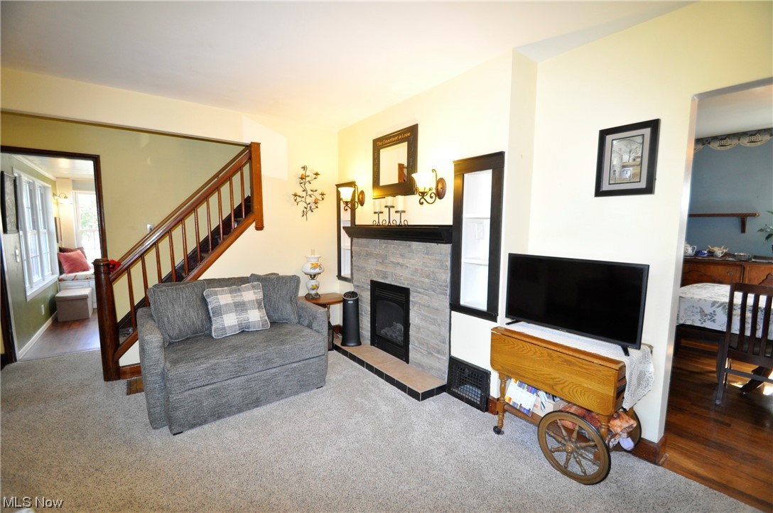 1899 West Pleasant Valley Road Parma, OH 44134 - Photo 6 of 47 Carpeted living room with a stone fireplace