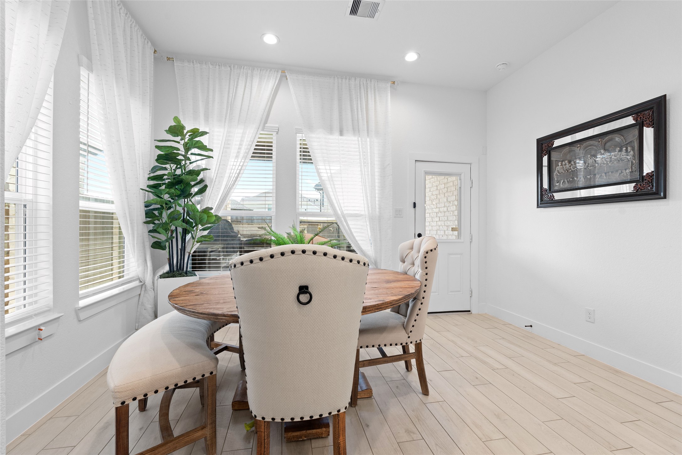 17735 Tree Of Heaven Conroe, TX 77385 - Photo 12 of 35 a view of a dining room with furniture window and wooden floor
