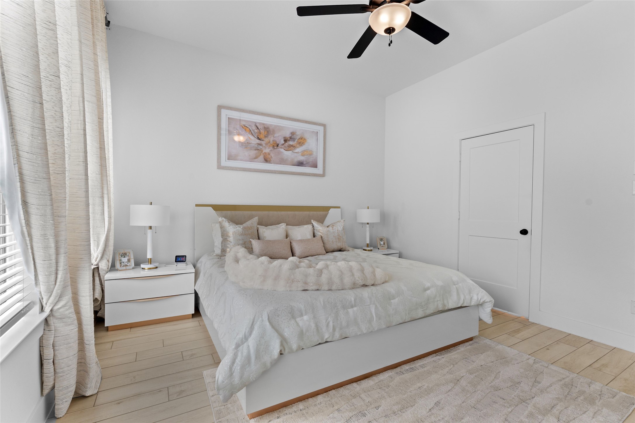 17735 Tree Of Heaven Conroe, TX 77385 - Photo 15 of 35 a bedroom with a bed and a chandelier