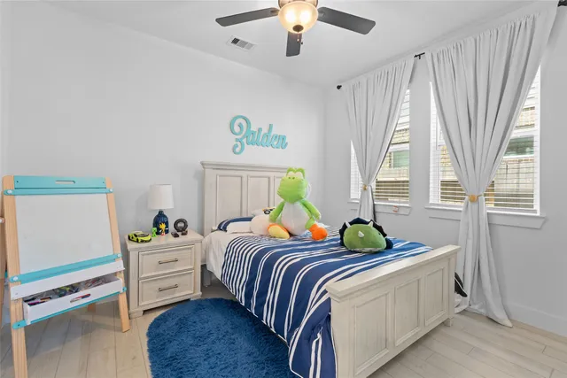 a bedroom with bed and window