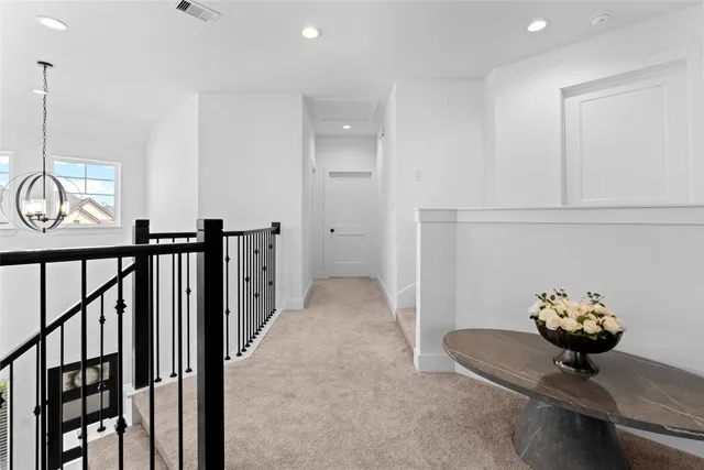 a view of hallway with furniture
