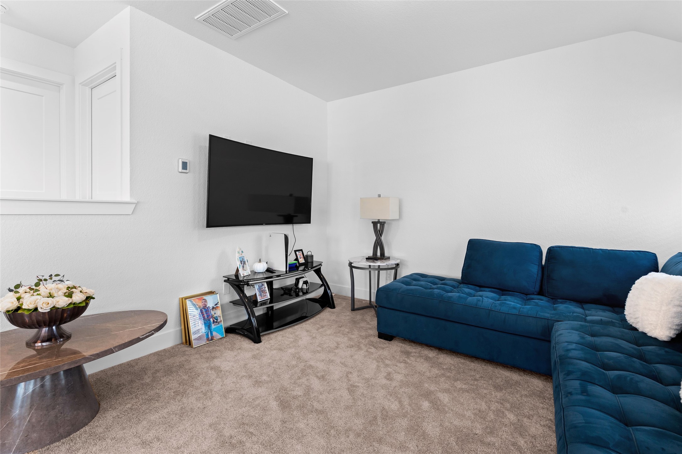17735 Tree Of Heaven Conroe, TX 77385 - Photo 22 of 35 a living room with furniture and a flat screen tv