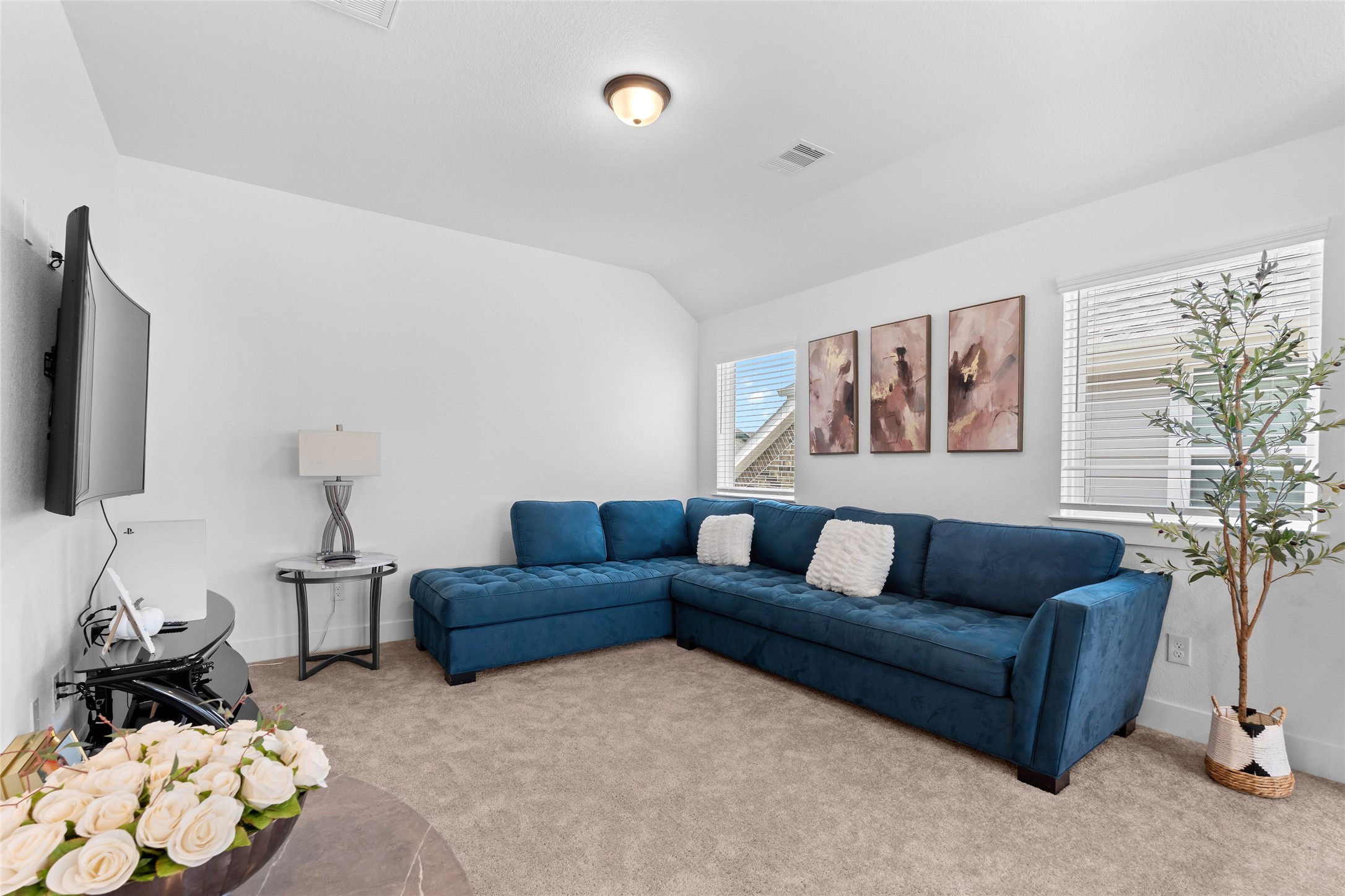 17735 Tree Of Heaven Conroe, TX 77385 - Photo 23 of 35 a living room with furniture and a flat screen tv