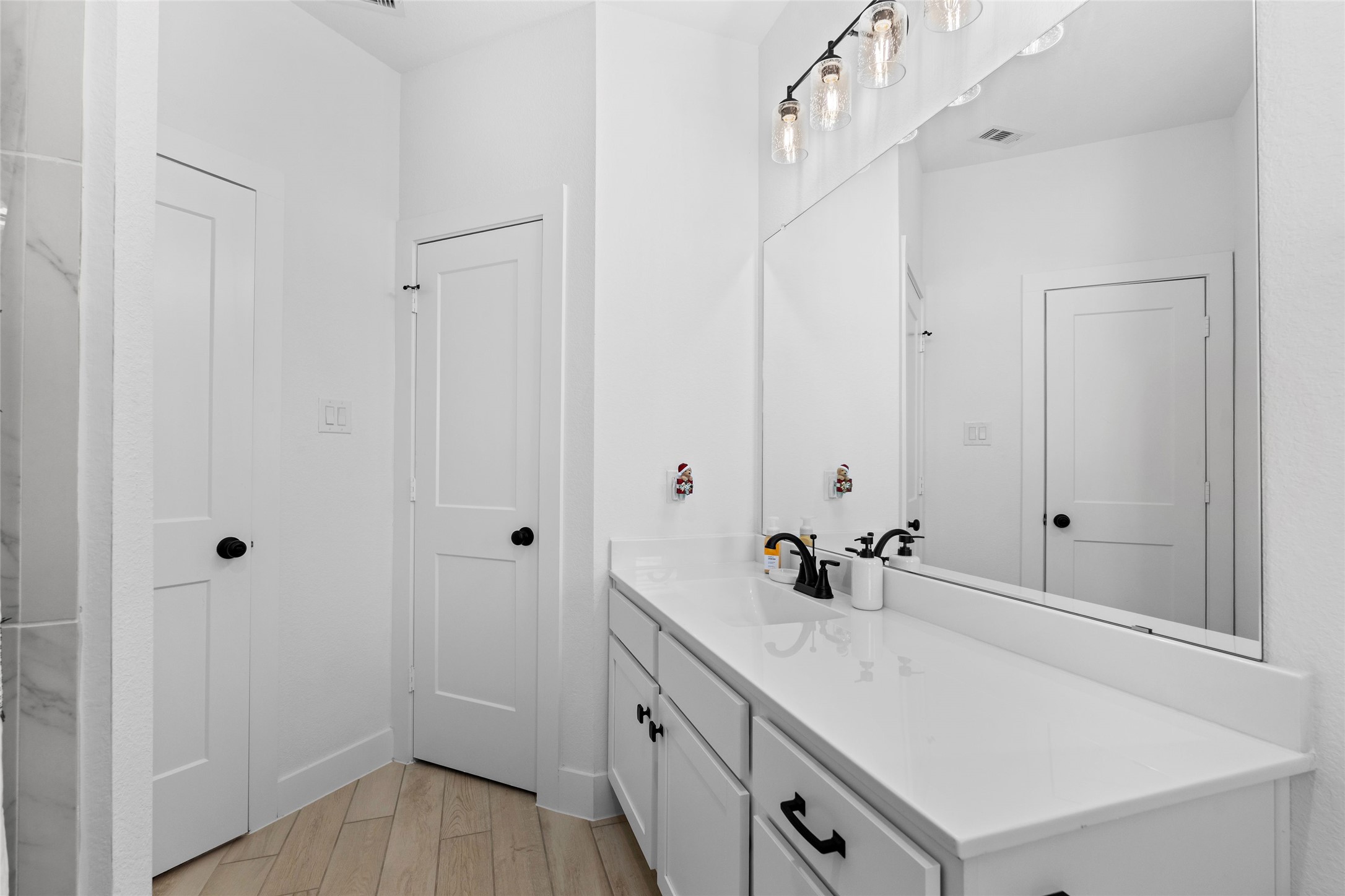 17735 Tree Of Heaven Conroe, TX 77385 - Photo 26 of 35 a bathroom with a sink and a mirror