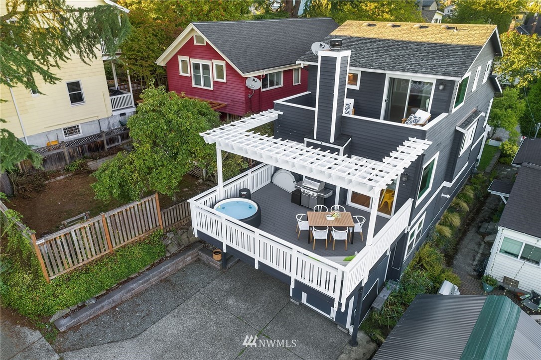 355 North 75th Street Seattle, WA 98103 - Photo 2 of 32 an aerial view of house and yard with deck and garden