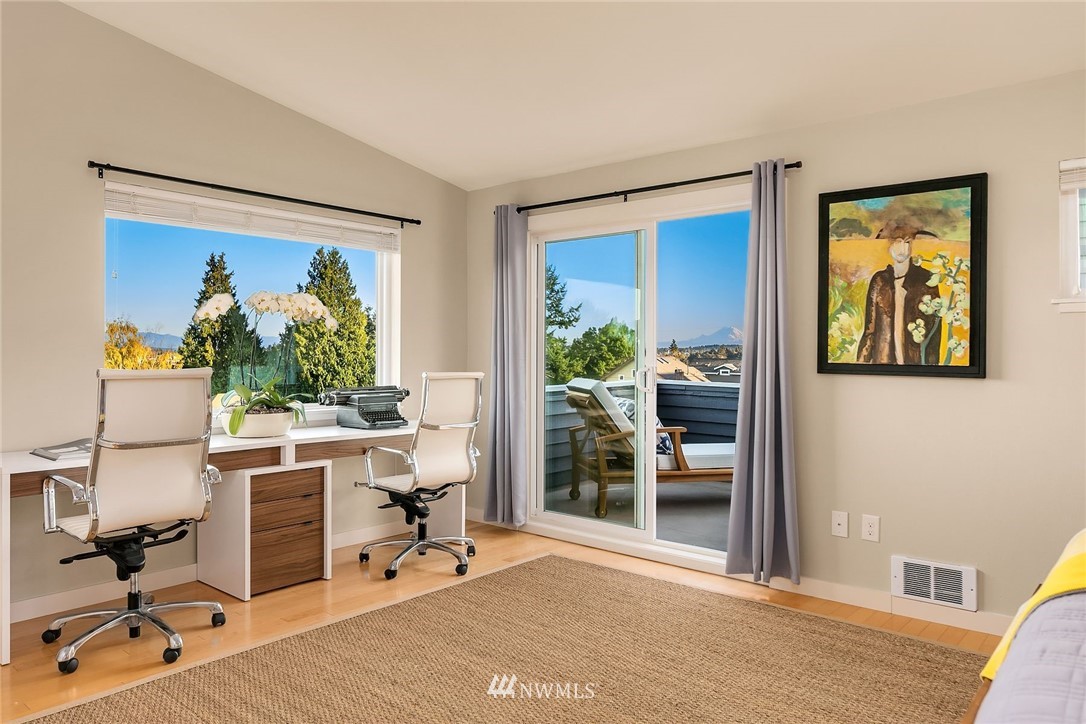 355 North 75th Street Seattle, WA 98103 - Photo 19 of 32 a view of a workspace with furniture and a window