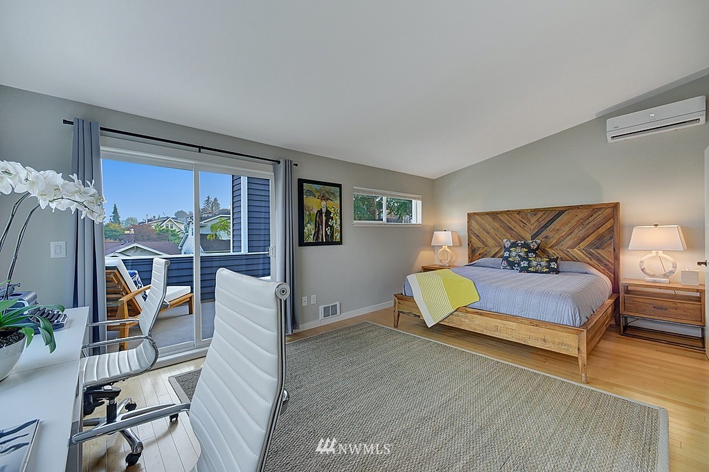355 North 75th Street Seattle, WA 98103 - Photo 21 of 32 a bedroom with furniture and a wooden floor