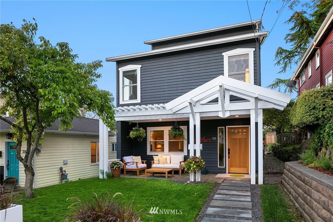 355 North 75th Street Seattle, WA 98103 - Photo 29 of 32 a front view of a house with a yard and porch
