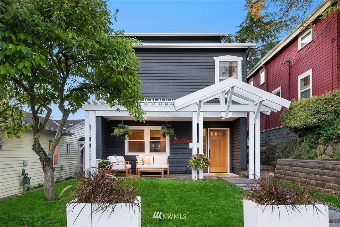 355 North 75th Street Seattle, WA 98103 - Photo 30 of 32 a view of a house with a yard and sitting area