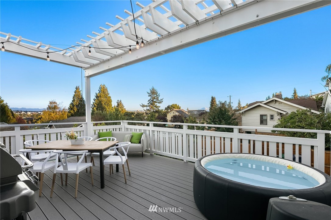 355 North 75th Street Seattle, WA 98103 - Photo 6 of 32 a view of a chairs and table on the roof deck